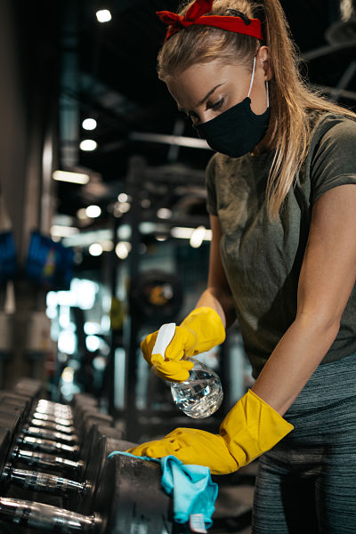 female worker disinfecting