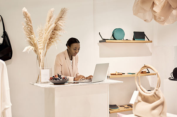 store manager using laptop