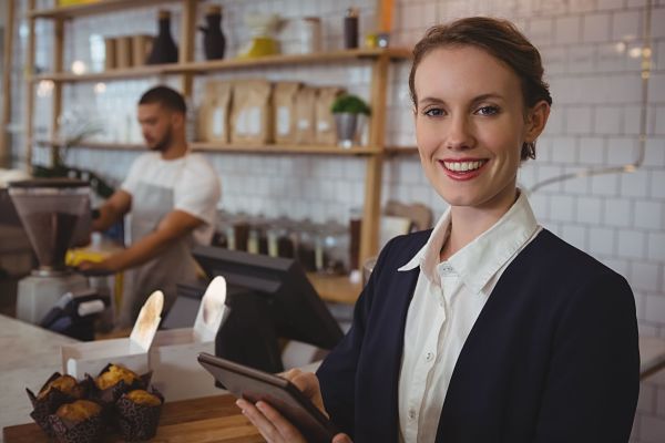 smiling owner using internal audit app