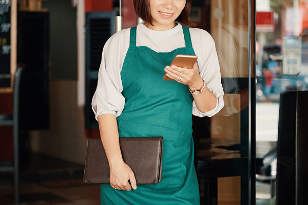 waitress using her phone
