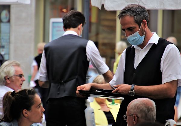 Restaurant staff serving customers